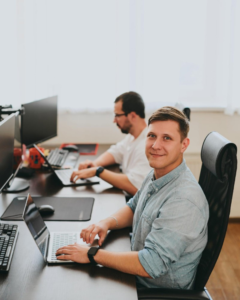 Mipo BT team at work in office — software developers at their desks