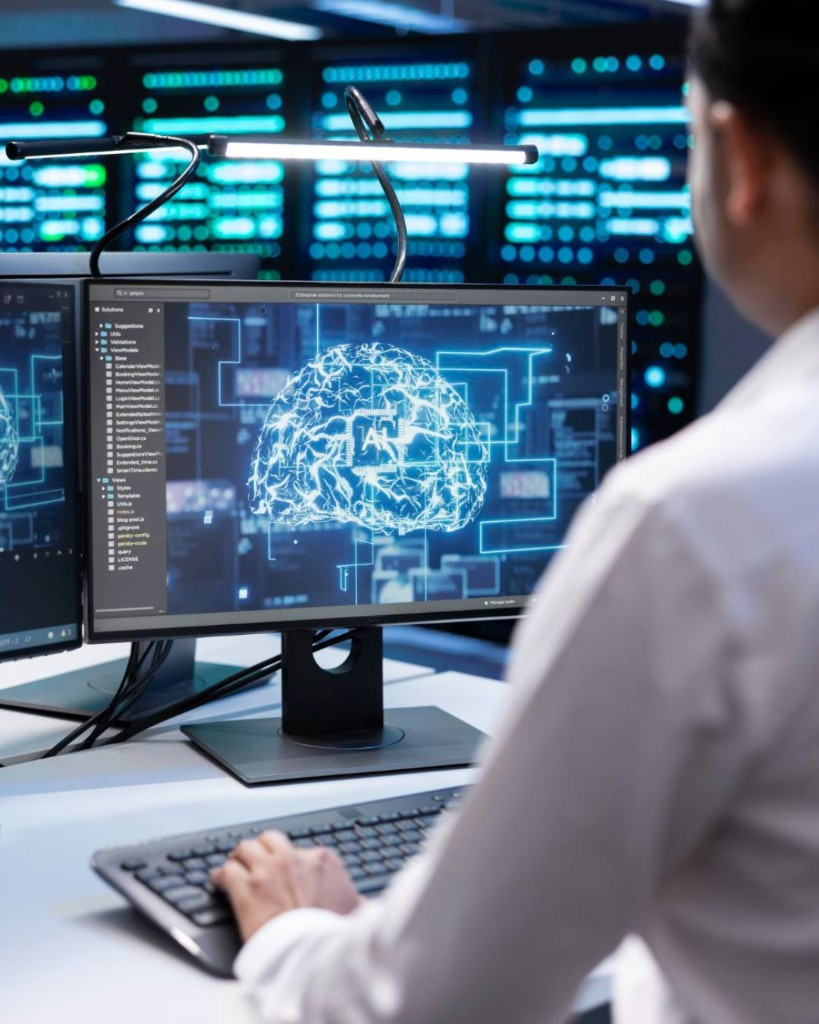 Software developer coding at monitor