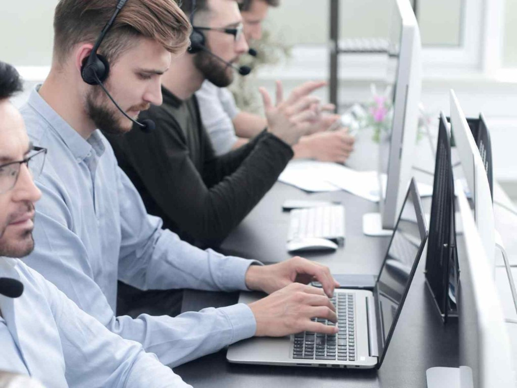IT support helpdesk team wearing headsets