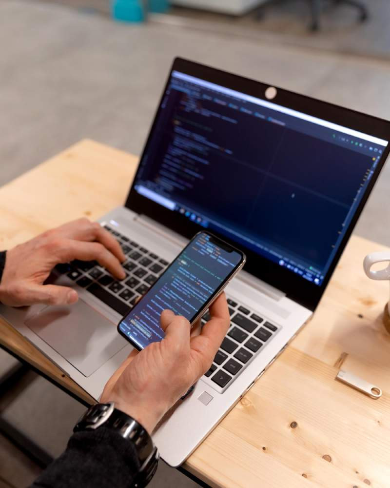 Software developer coding at monitor
