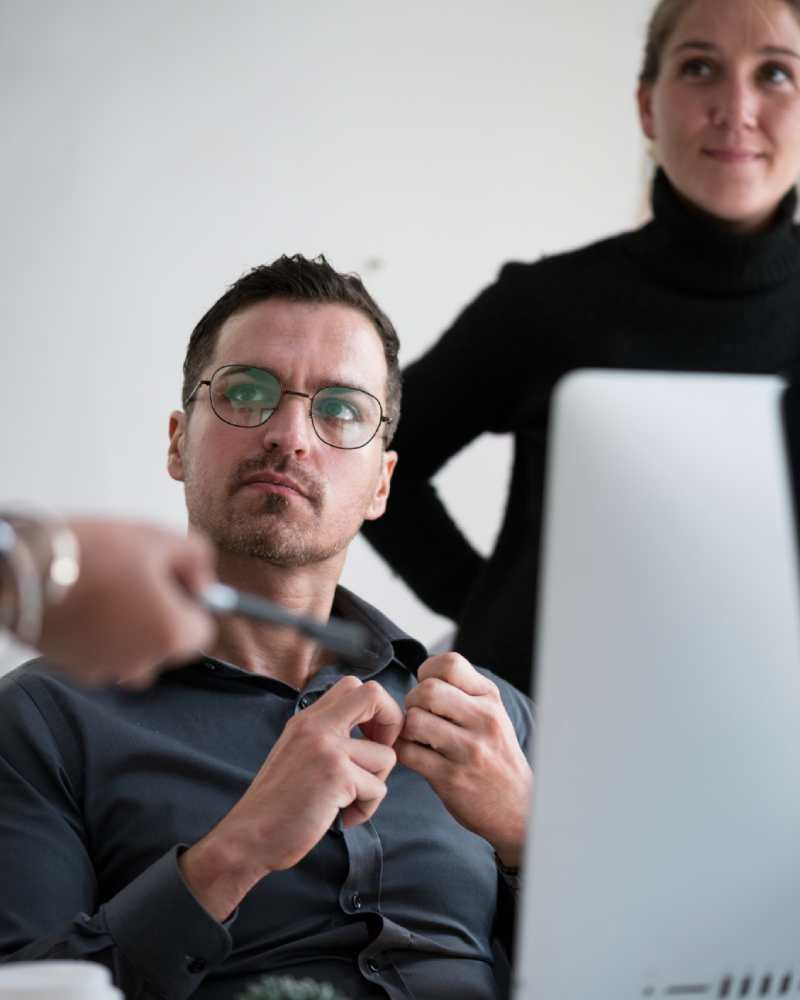 Software developer coding at monitor